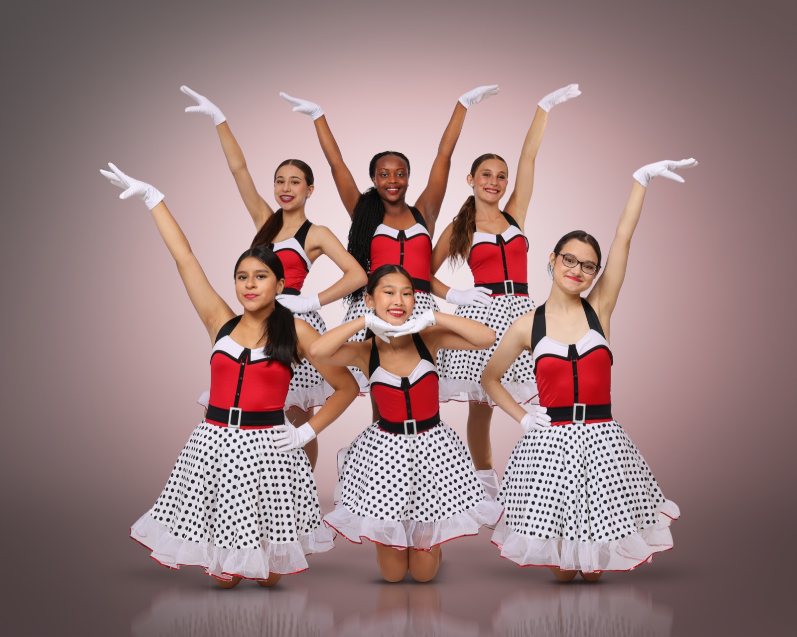 Musical theater dancers performing with expression.